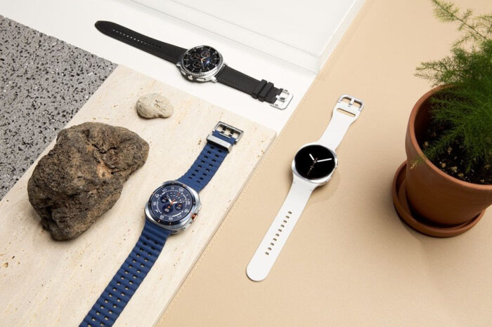Samsung Galaxy Watch8 Ultra en reloj de mano con correa naranja mostrando datos de salud. 